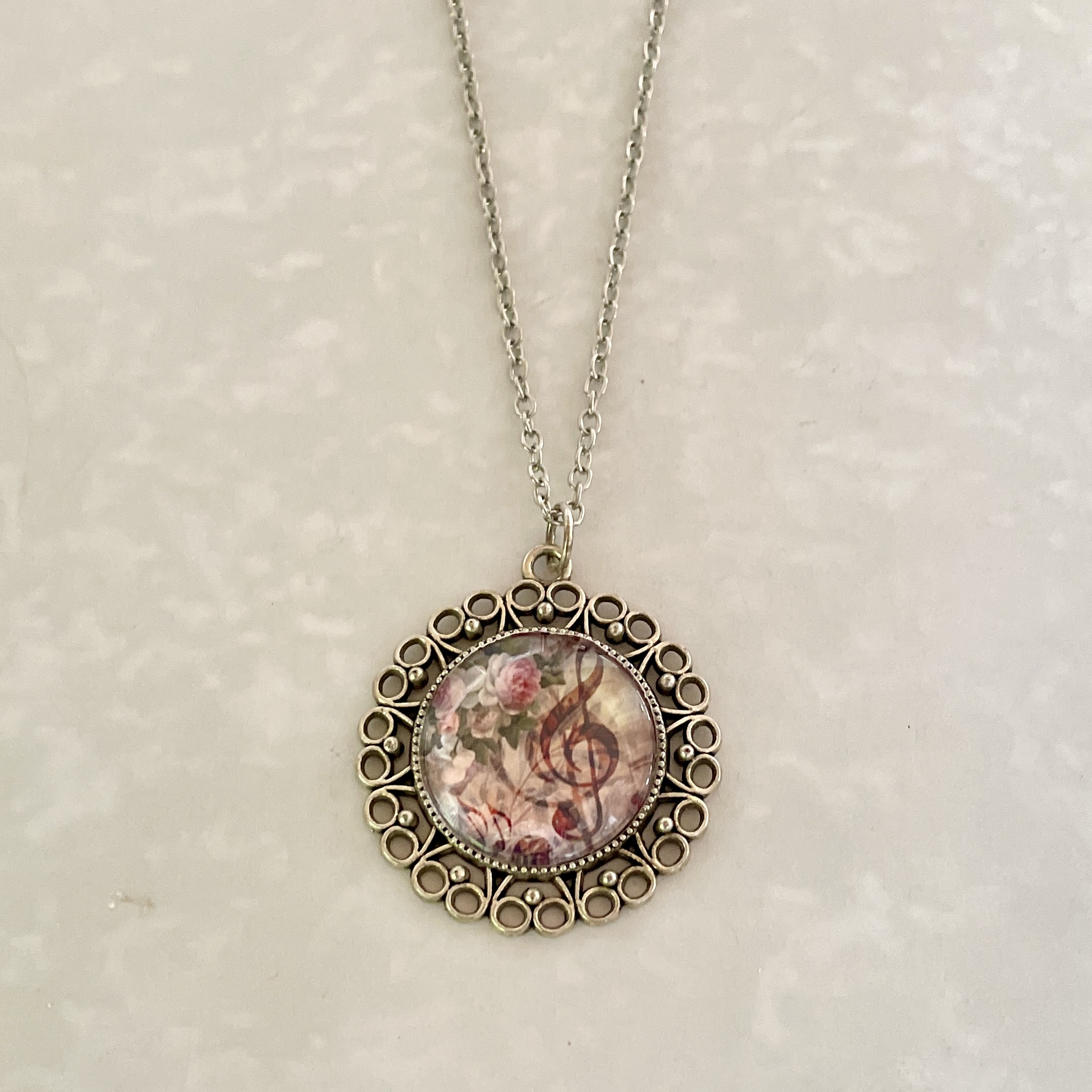 Vintage floral treble clef pendant necklace