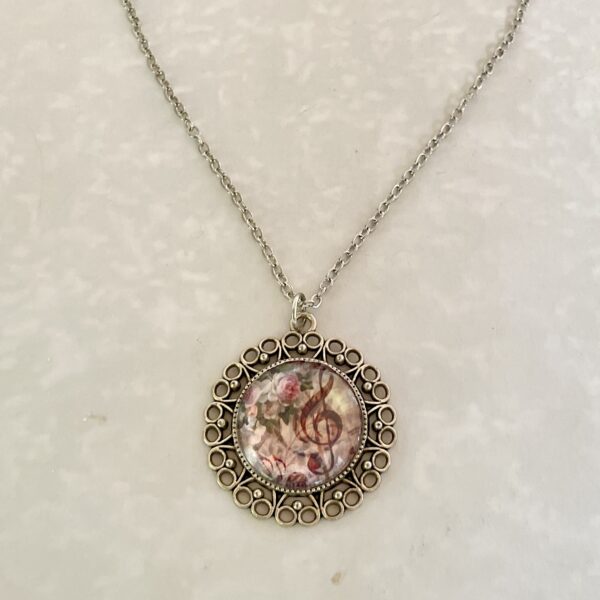 Ornate filigree floral treble clef pendant necklace