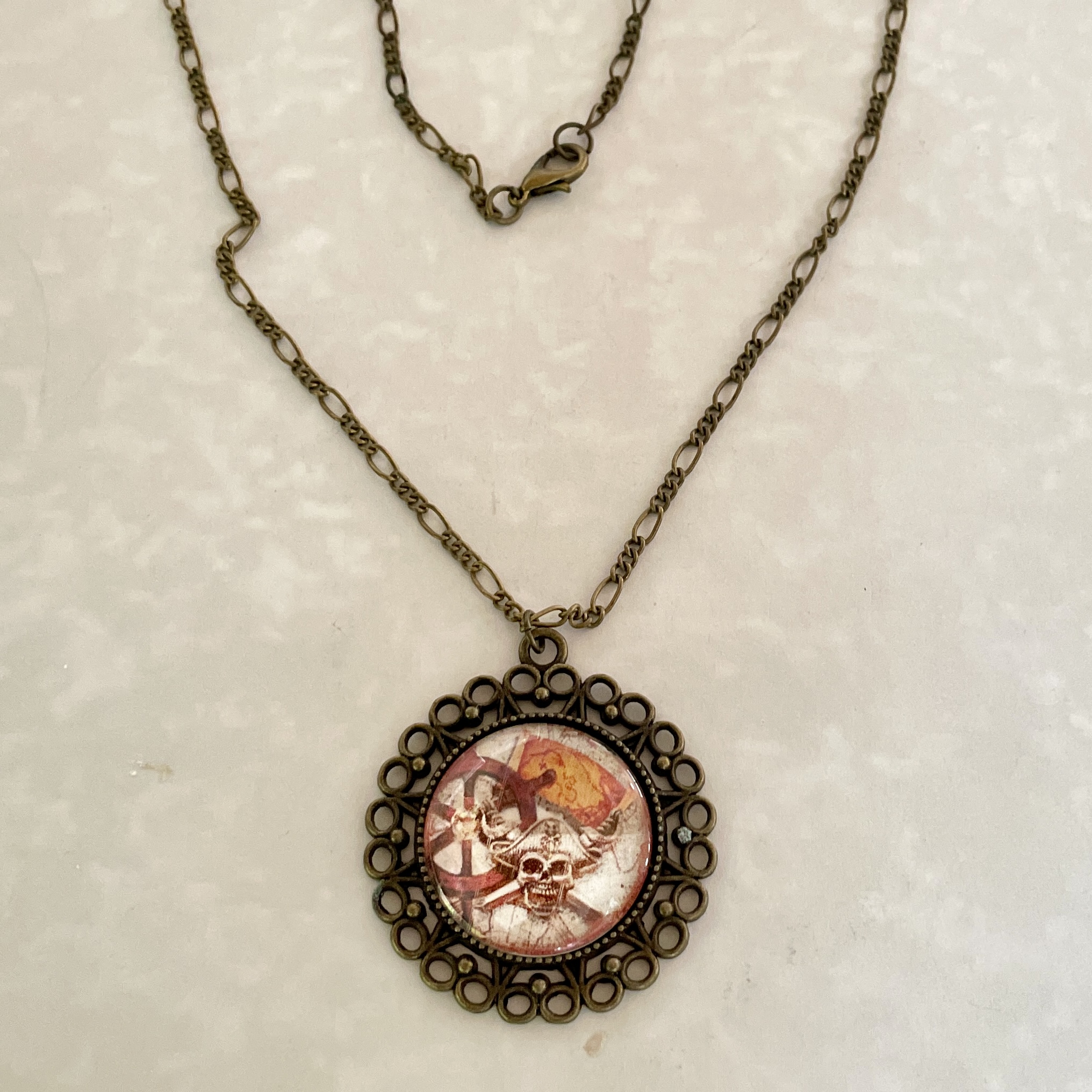 Antique bronze filigree necklace with skull pendant