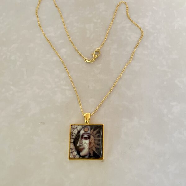 Gold chain with sun-and-moon square pendant