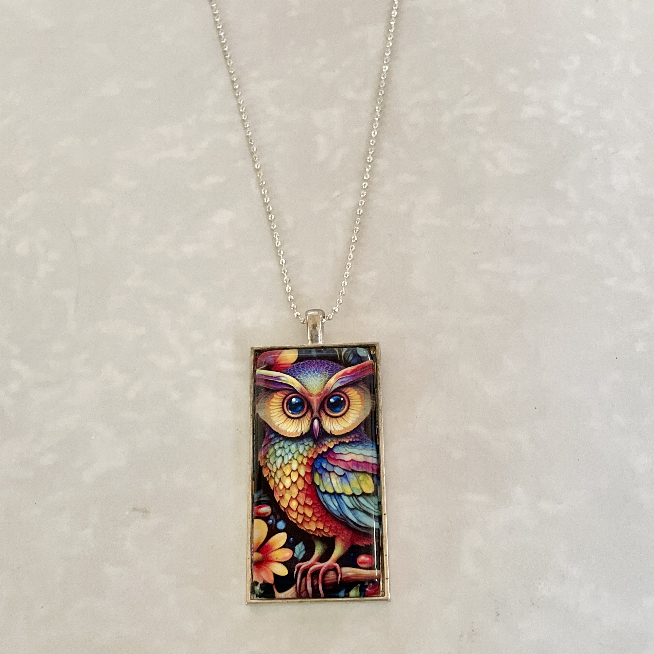 Colorful owl pendant on silver chain