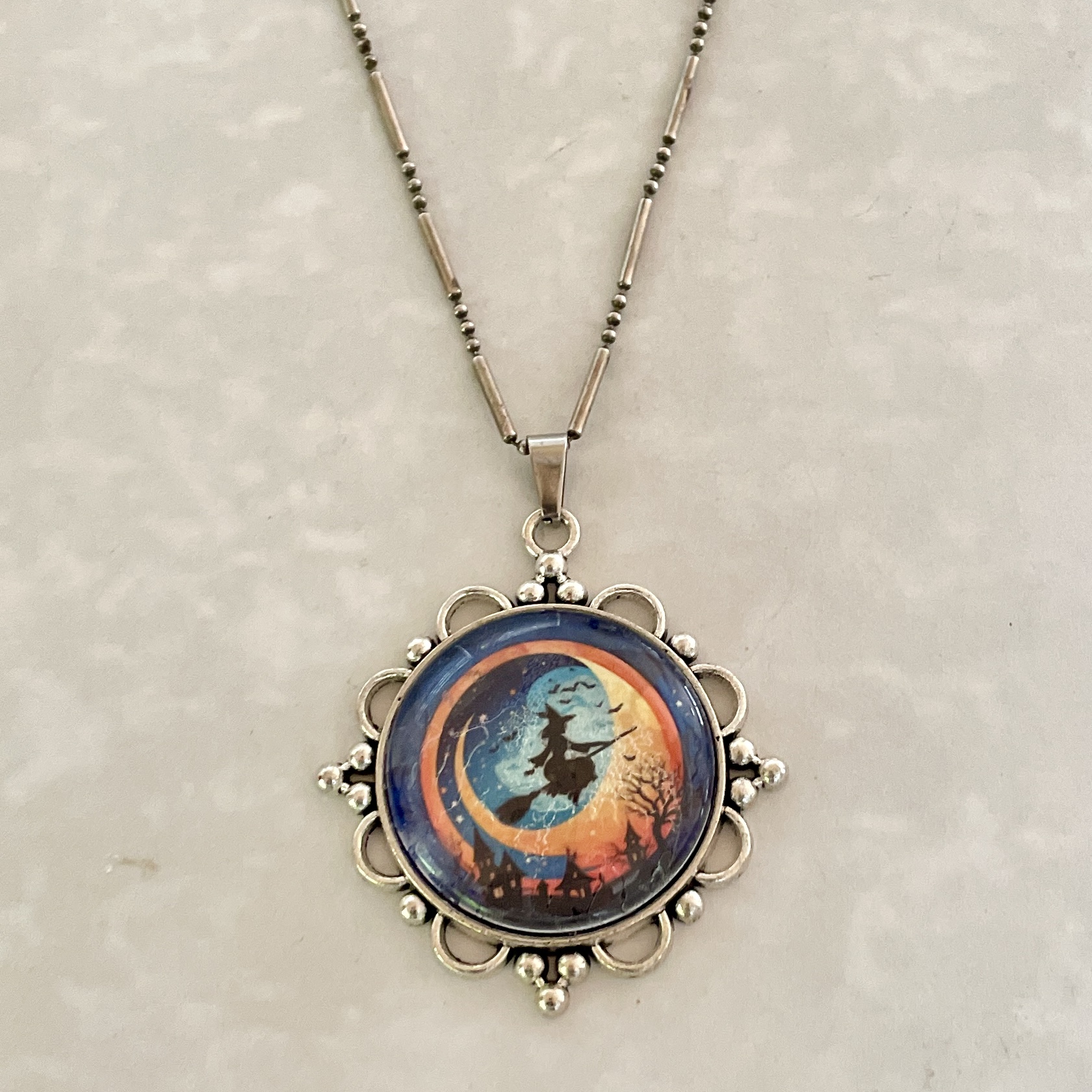 Witch silhouette pendant necklace with moon