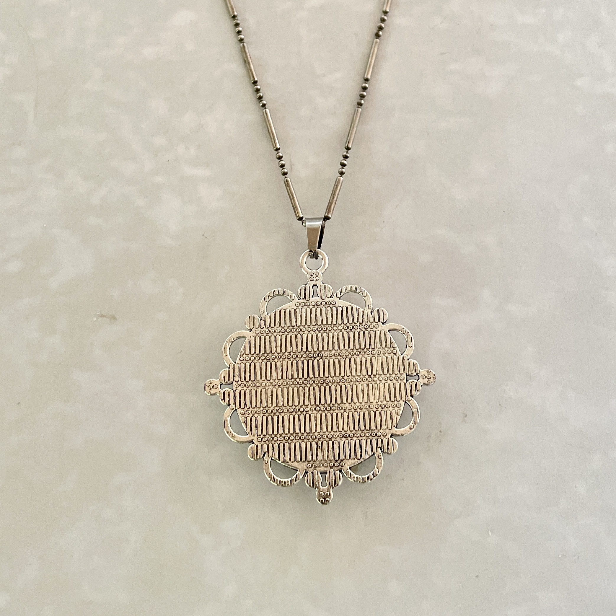 Intricate silver filigree pendant necklace