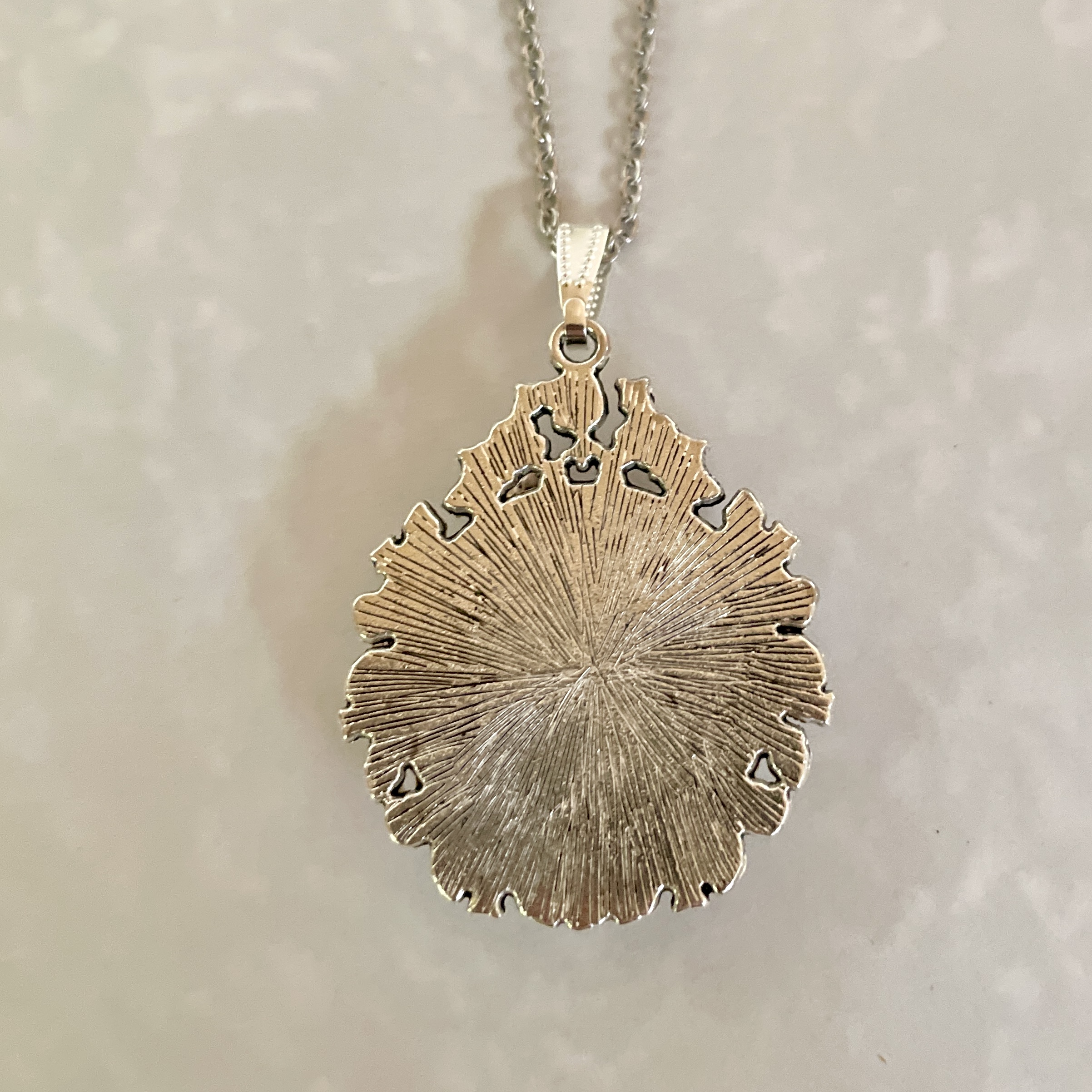 Silver textured pendant necklace on chain