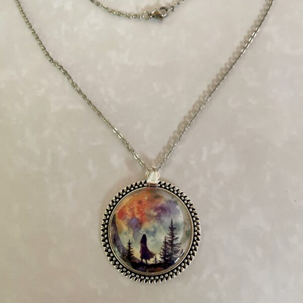 Silver pendant with girl silhouette and colorful sky