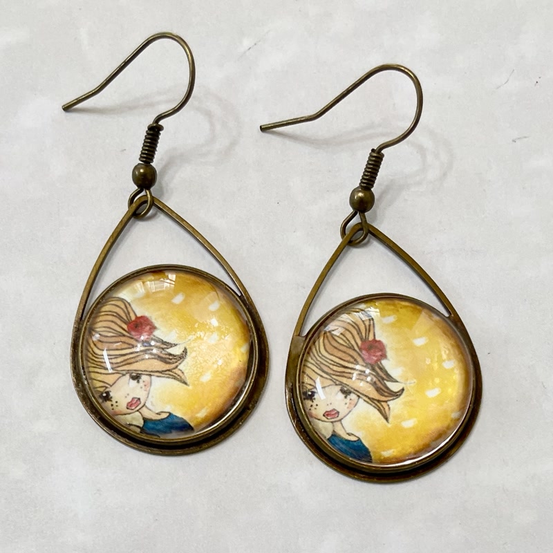 Bronze teardrop earrings with illustrated girl