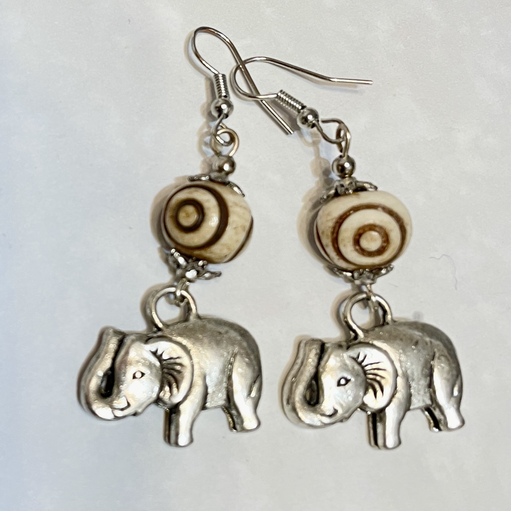Elephant charm earrings with spiral beads.