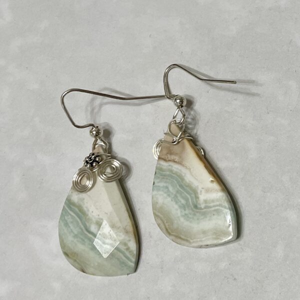 Elegant earrings featuring striped green stones.