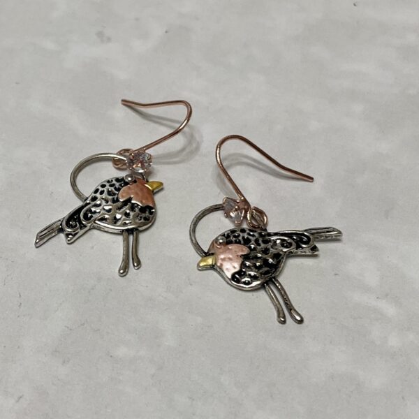 Charming bird-shaped earrings with mixed metals.