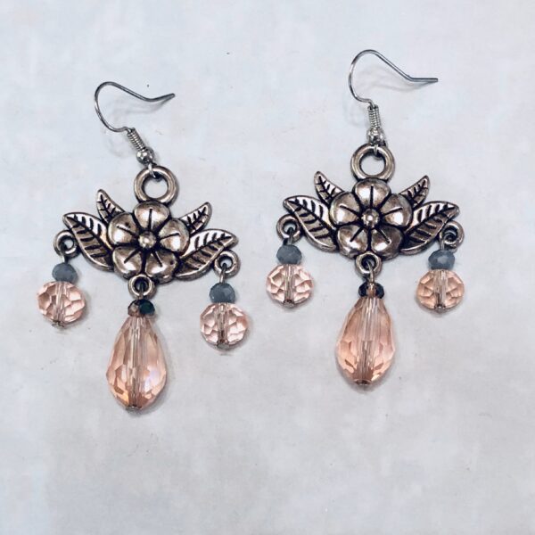Floral earrings with pink and silver accents.