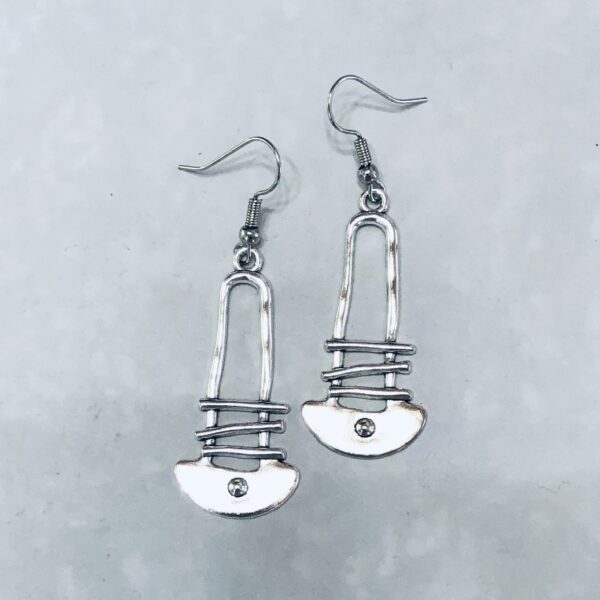 Silver earrings designed like safety pins.
