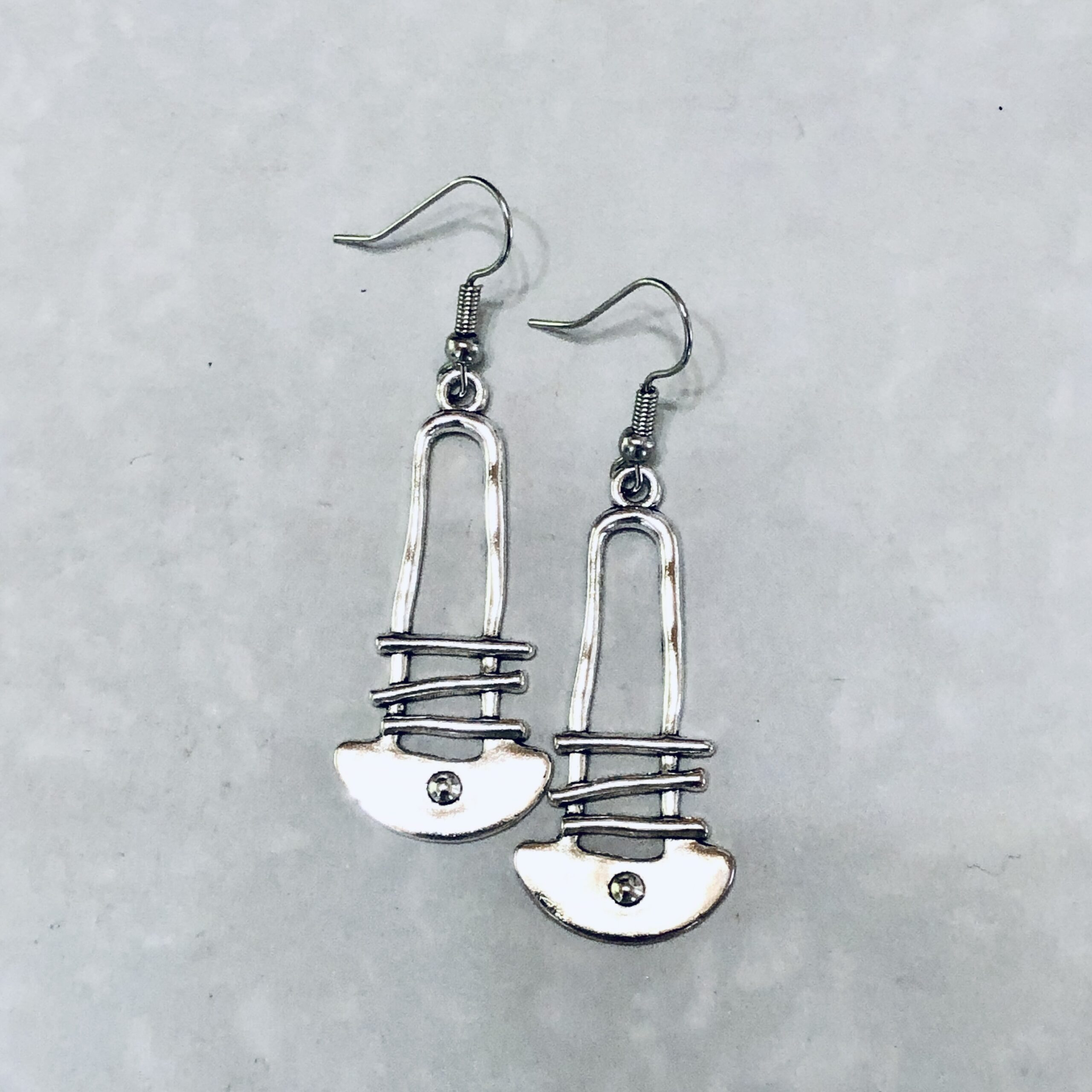 Stylish silver earrings with unique design elements.