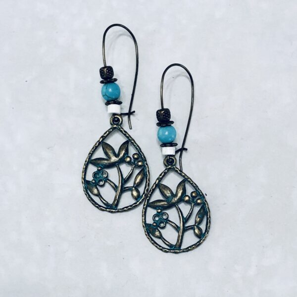 Vintage floral earrings with turquoise accents.