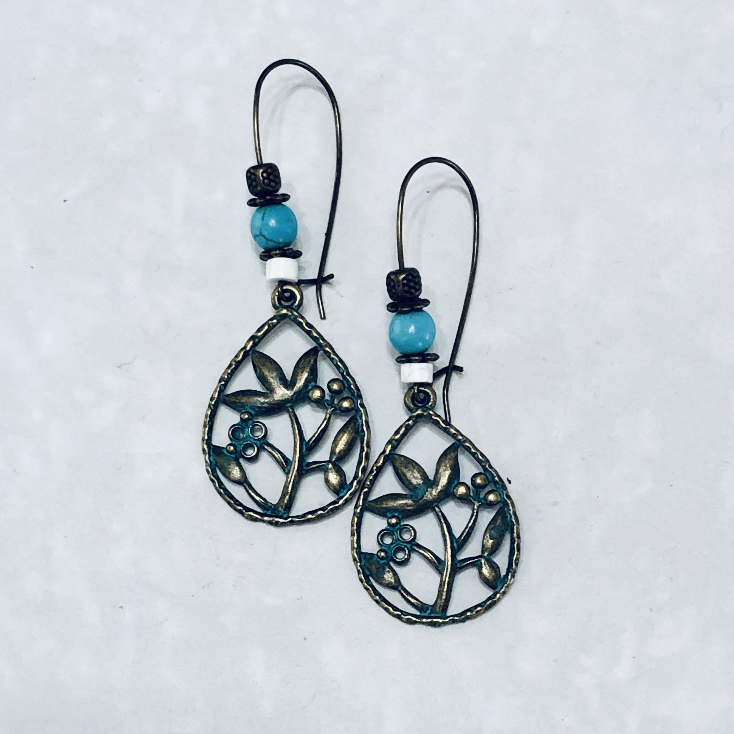 Vintage floral earrings with turquoise accents.